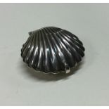 A silver hinged box in the form of a shell. Approx
