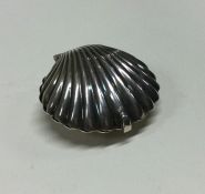 A silver hinged box in the form of a shell. Approx