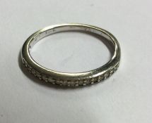 A 9 carat diamond half eternity ring set in gold.