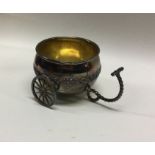 A novelty silver miniature cart on wheels. Marked