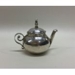 A Queen Anne miniature silver teapot. London 1702.