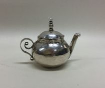 A Queen Anne miniature silver teapot. London 1702.