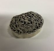A heavy silver pierced snuff box with hinged lid d