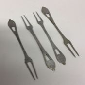 A set of four silver pickle forks. Apparently unma