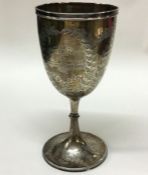 A Victorian silver goblet engraved with leaves. Ap