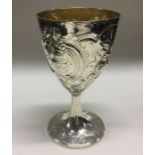 A large heavy George III silver chased goblet with