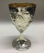 A large heavy George III silver chased goblet with