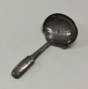 A George III silver caddy spoon with basket weave