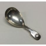 A George III silver caddy spoon with shell back. L