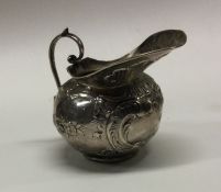 A Victorian silver chased jug. Bearing import mark