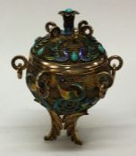 A Chinese silver and enamel tea caddy. Approx. 151