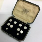 A cased set of white gold cufflinks and bu
