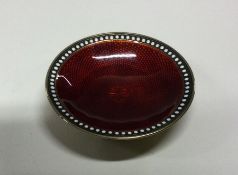 A Norwegian silver and red enamel dish with handle