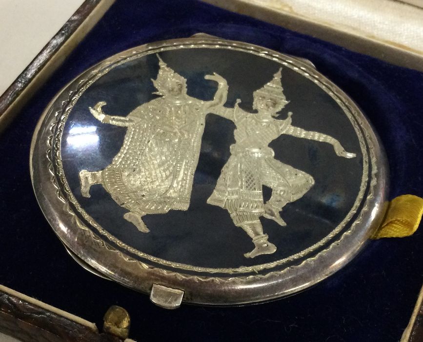 A cased Thai silver and Niello compact. Approx. 65 - Image 2 of 2