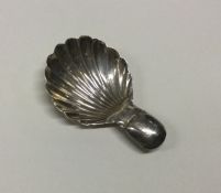 A George III silver caddy spoon with bright cut de