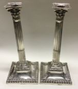 A tall pair of silver candlesticks. London 1767. B