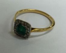 An attractive Antique emerald and diamond cluster