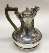 A large George III silver crested water jug / coff