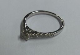 A 9 carat diamond single stone ring. Approx. 2 gra