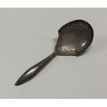 A George III silver caddy spoon. Birmingham 1812.