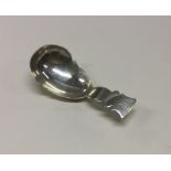 A George III silver caddy spoon. London 1810. By T