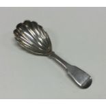 A large silver George III caddy spoon with fluted