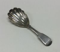 A large silver George III caddy spoon with fluted