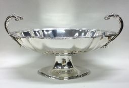 A large silver shaped two handled sweet dish on sw
