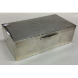 A rectangular silver cigarette box with hinged lid