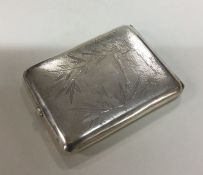 A Chinese silver hammered effect cigarette case en