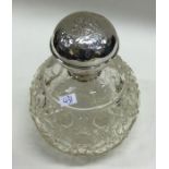 A large silver mounted glass scent bottle with che