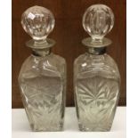 A pair of silver mounted decanters. Est. £30 - £40