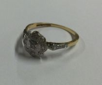 A stylish Antique diamond cluster ring set in 18 c