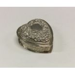 A heavy chased silver heart shaped box. London 197