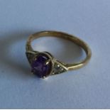 An amethyst and diamond seven stone ring in 9 cara