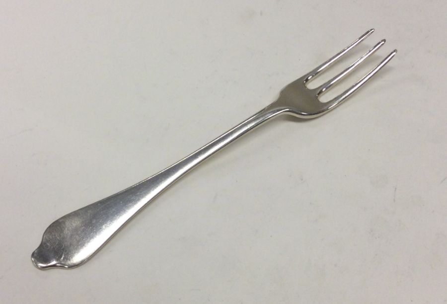 A Queen Anne silver dog nose table fork. London ci