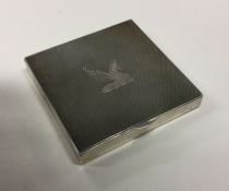 An engine turned silver box with hinged lid. By Go