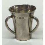 ASPREY & CO: A three handled silver tyg. Birmingha