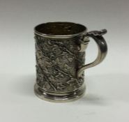 A George III silver mug with vine decoration. Lond