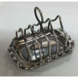 A Victorian silver toast rack. Birmingham 1899. By