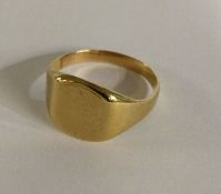 A plain 9 carat signet ring. Approx. 6 grams. Est.