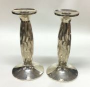 An unusual pair of silver candlesticks. Approx. 70