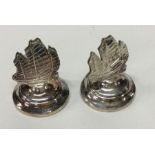A pair of silver ship menu holders. Marked Sterlin