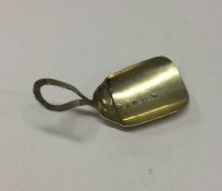A silver gilt caddy spoon with loop handle. Birmin