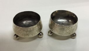 A pair of Victorian silver salts engraved with flo