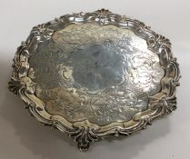 A Victorian silver salver with engraved decoration