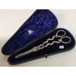 A good pair of silver plated grape scissors contai