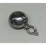 A George III silver caddy spoon with rope border.