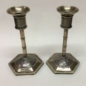 WANG HING: A decorative pair of Chinese silver can
