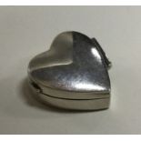 A silver heart shaped box. Approx. 8 grams. Est. £